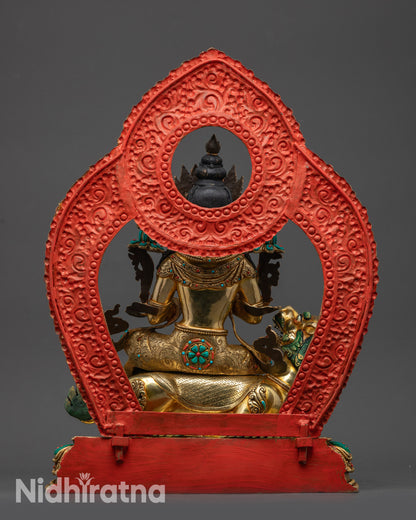 Back view of Manjushri statue showing intricate robe patterns and gold-gilded base