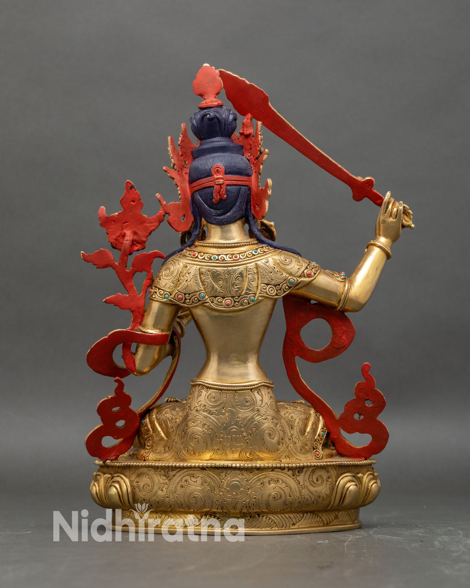 Back-view-of-Manjushri-statue-with-detailed-robe-engravings-and-halo-structure