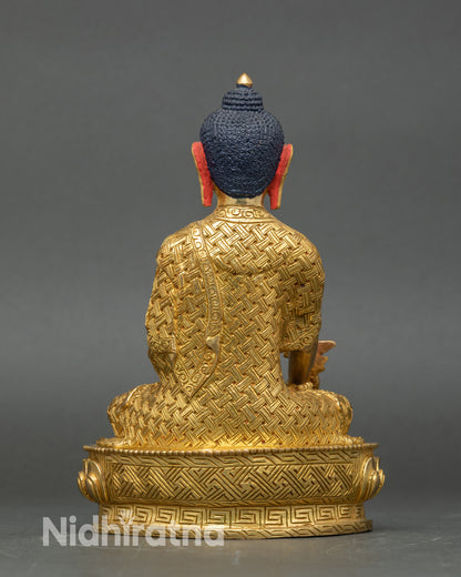 Back view of Medicine Buddha statue, detailed lotus seat and gold-gilded craftsmanship