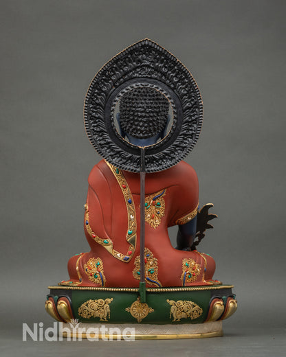 Back view of Medicine Buddha statue showing halo and monk garment details, Nepalese craftsmanship
