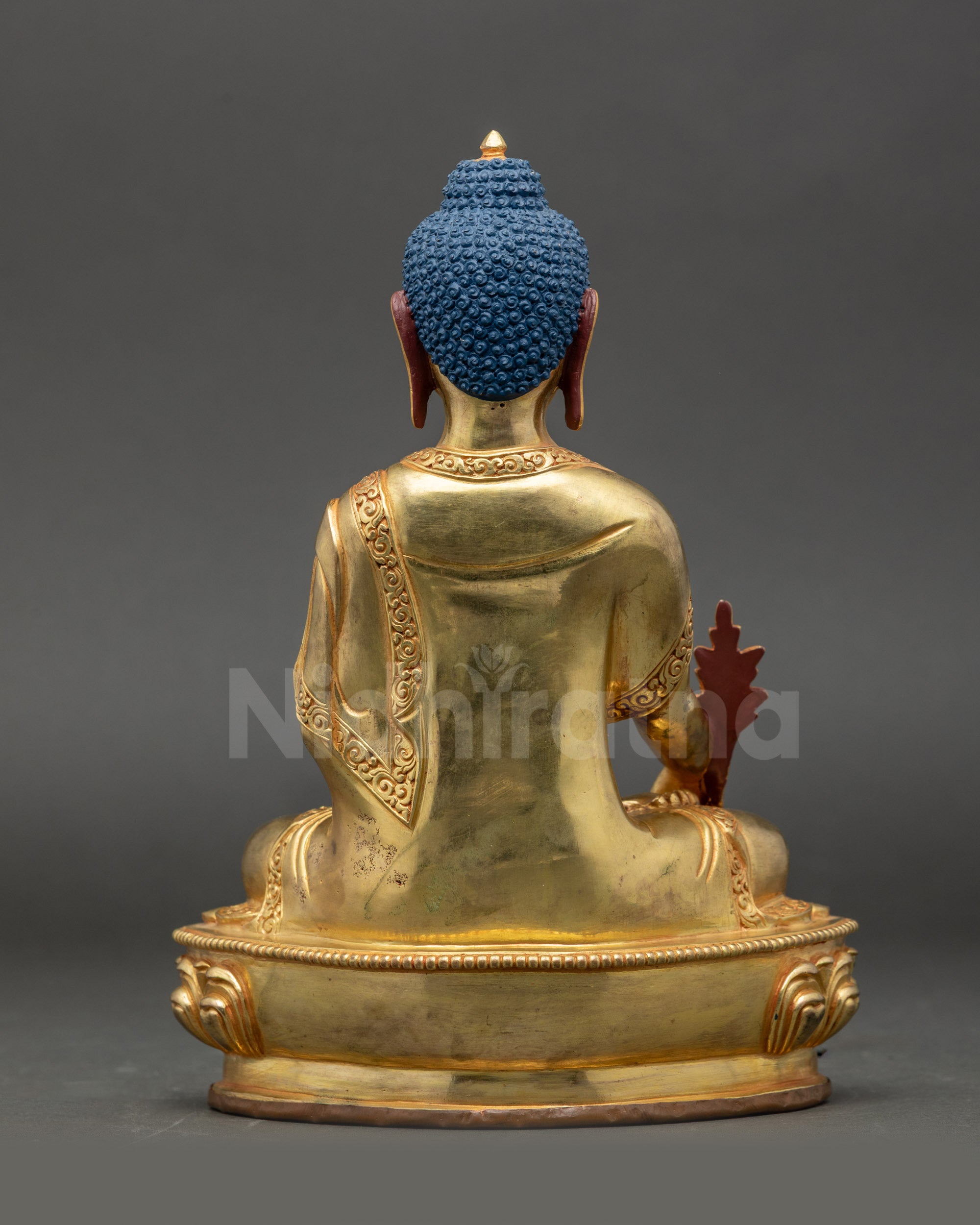 Back view of Medicine Buddha statue showing intricate Newari artisan craftsmanship