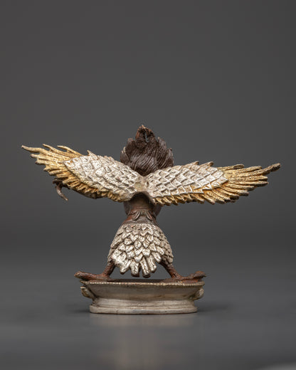 Back view of Mighty Garuda deity statue highlighting detailed craftsmanship and silver finish