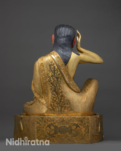 Back view of Milarepa statue showing detailed robe patterns and Nepalese craftsmanship