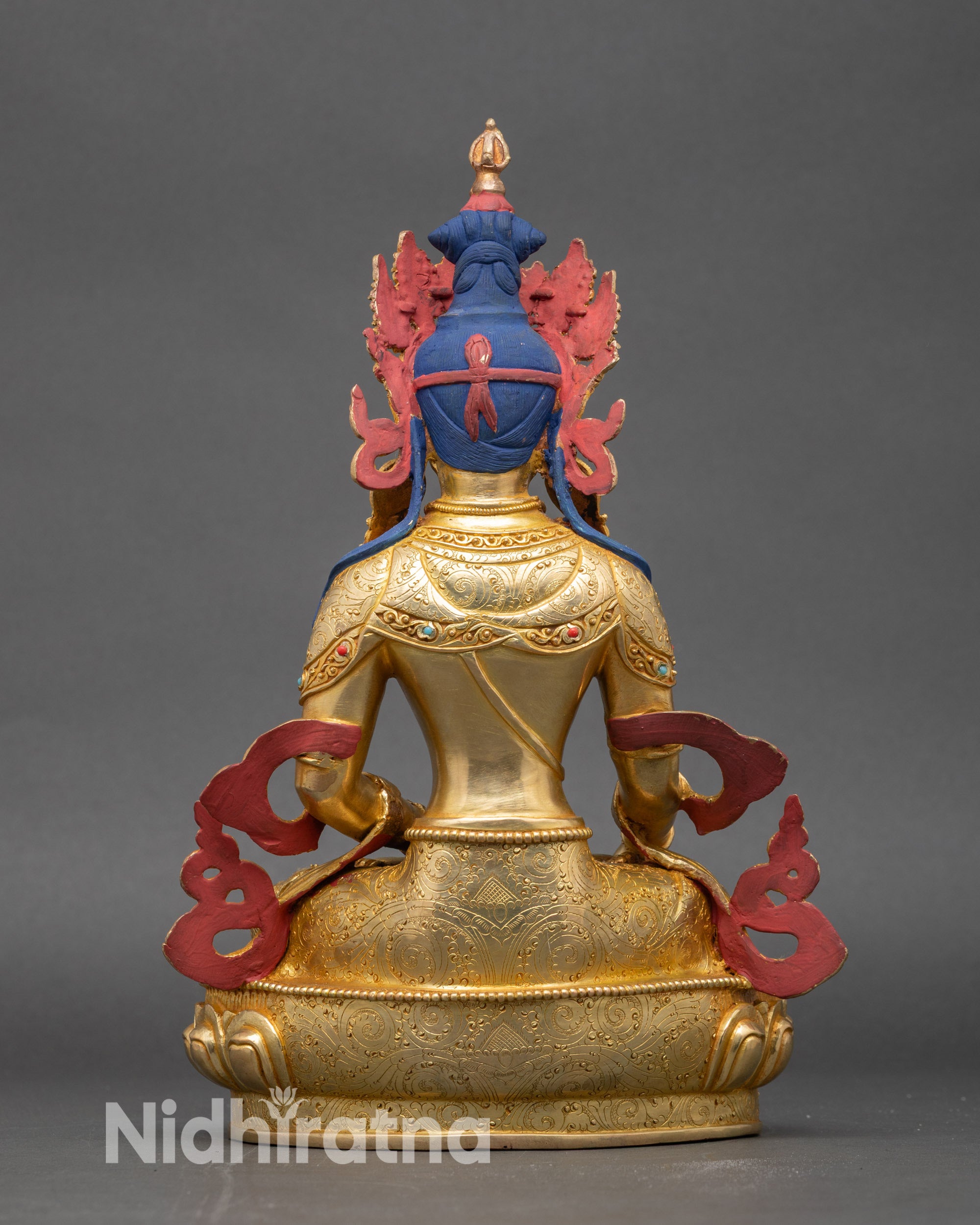 Back view of Mitrugpa statue showing lotus throne and engraved spiritual details