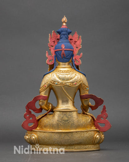 Back view of Mitrugpa statue showing lotus throne and engraved spiritual details