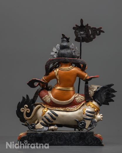 Back view of Namtoshe Sculpture highlighting swirling robe and radiant carved halo