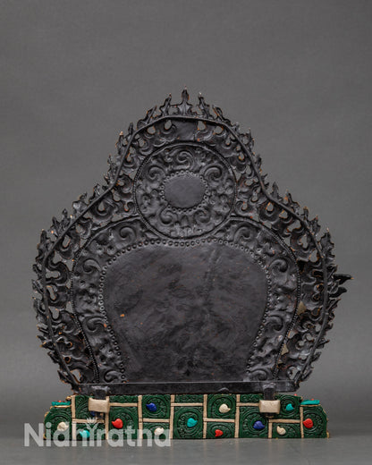 Back view of Namtoshe statue, detailed robes, hand-painted halo, and copper craftsmanship
