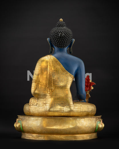 Back view of Nepalese Healing Medicine Buddha Statue highlighting carved monk robes and form