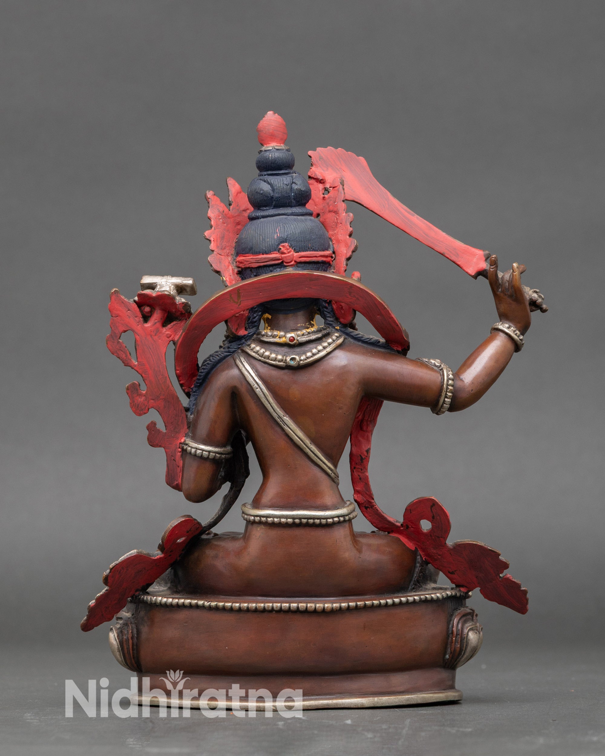 Back view of Nepalese Manjushri statue with detailed lotus throne and artisan craftsmanship