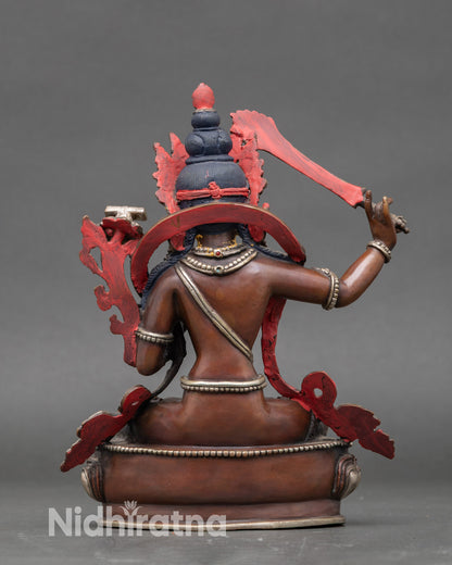 Back view of Nepalese Manjushri statue with detailed lotus throne and artisan craftsmanship