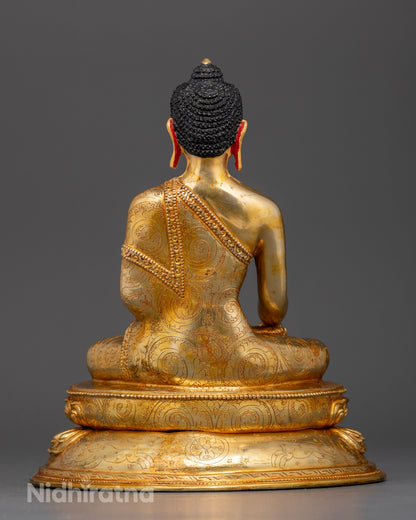 Back view of Nepalese Sakyamuni Buddha statue on lotus throne, detailed sacred artwork