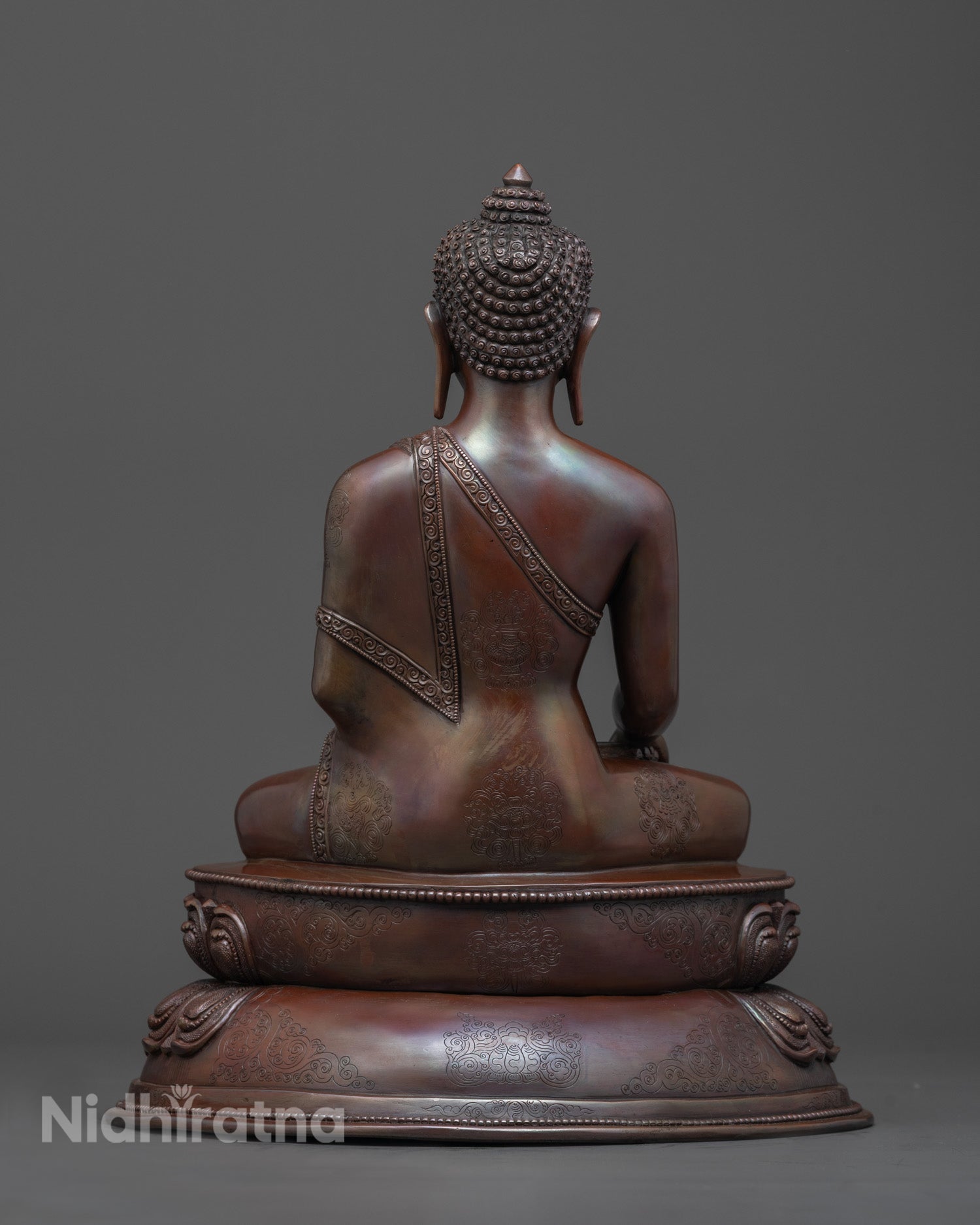 Back view of Oxidized Copper Shakyamuni Buddha Statue with detailed robe and lotus throne