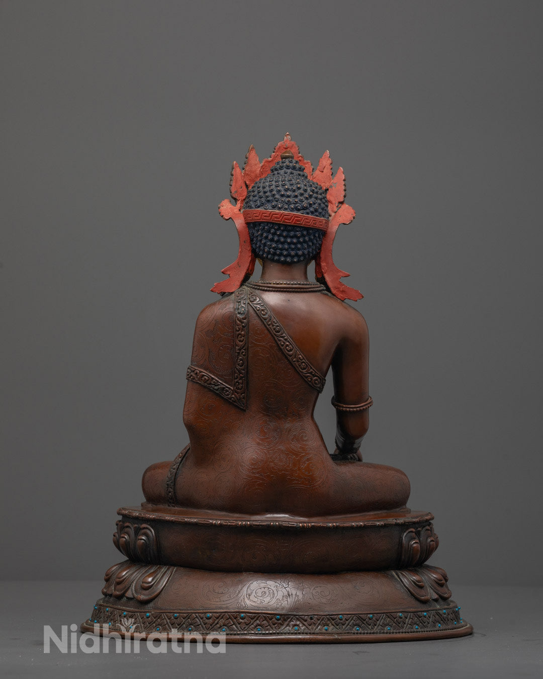 Back view of Oxidized Crowned Shakyamuni Buddha seated on lotus base with semi-precious stones