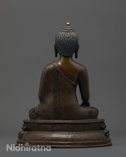 Back view of Oxidized Gautama Buddha Statue showing robe patterns and earthy hue finish