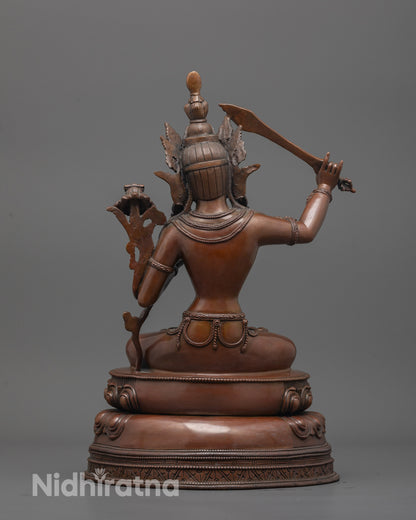 Back view of Oxidized Manjushri Statue highlighting detailed robe and lotus petals