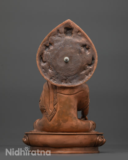 Back view of Oxidized Shakyamuni Buddha Statue highlighting robe folds and miniature Garuda head