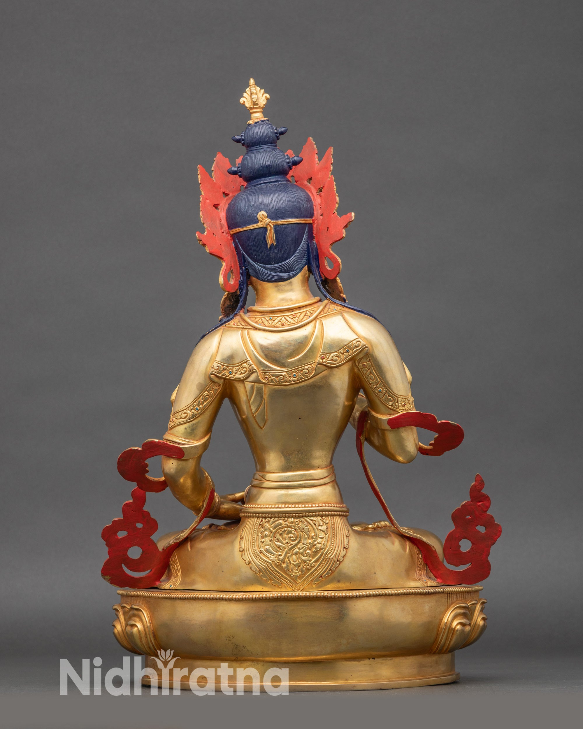 Back view of Purification Buddha statue, intricate robe details, traditional Nepalese craftsmanship