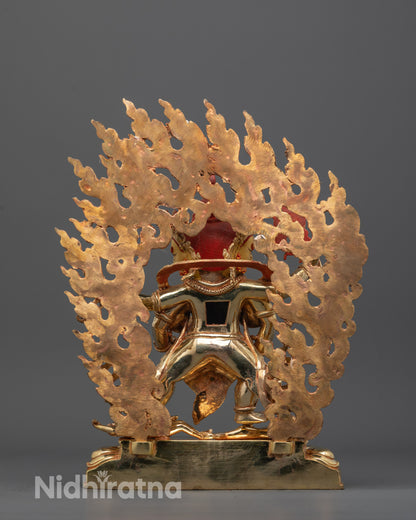 Back view of Red Dzambhala statue highlighting intricate craftsmanship and consecration chamber