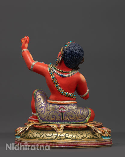 Back view of Red Hued Virupa Sculpture highlighting intricate carvings and vibrant colors
