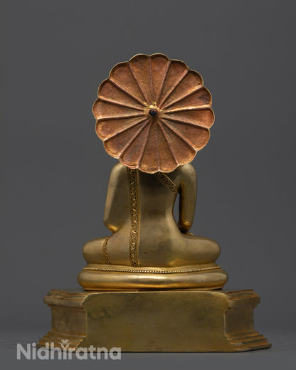 Back view of Sacred Buddha Sculpture highlighting detailed carvings on robe and halo