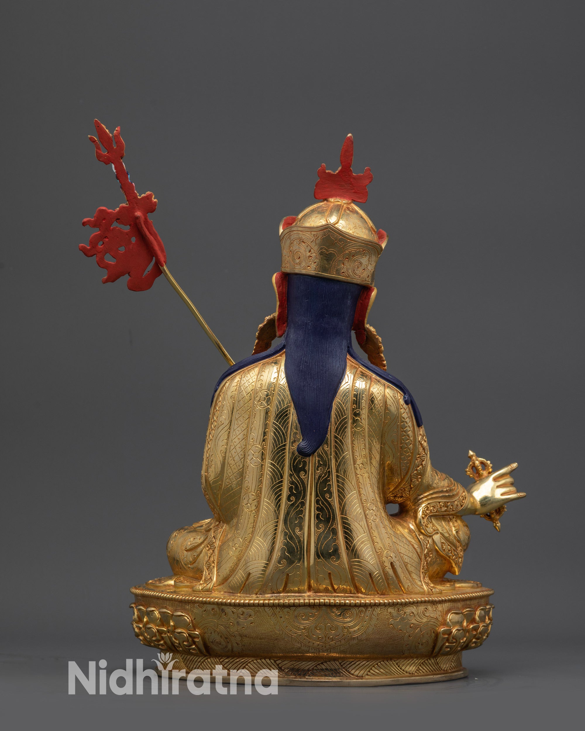 Back view of Sacred Guru Rinpoche Statue with intricate robe and fire-gilded copper base