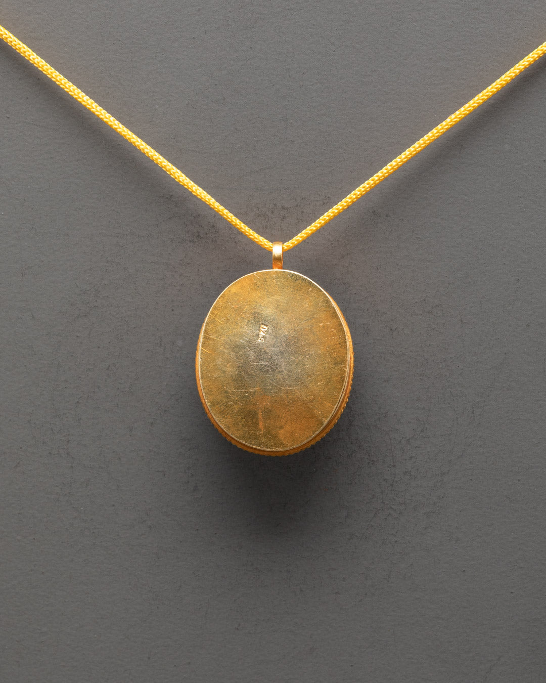 Back view of Sacred Tibetan Locket Pendant showing detailed artisan work and smooth finish