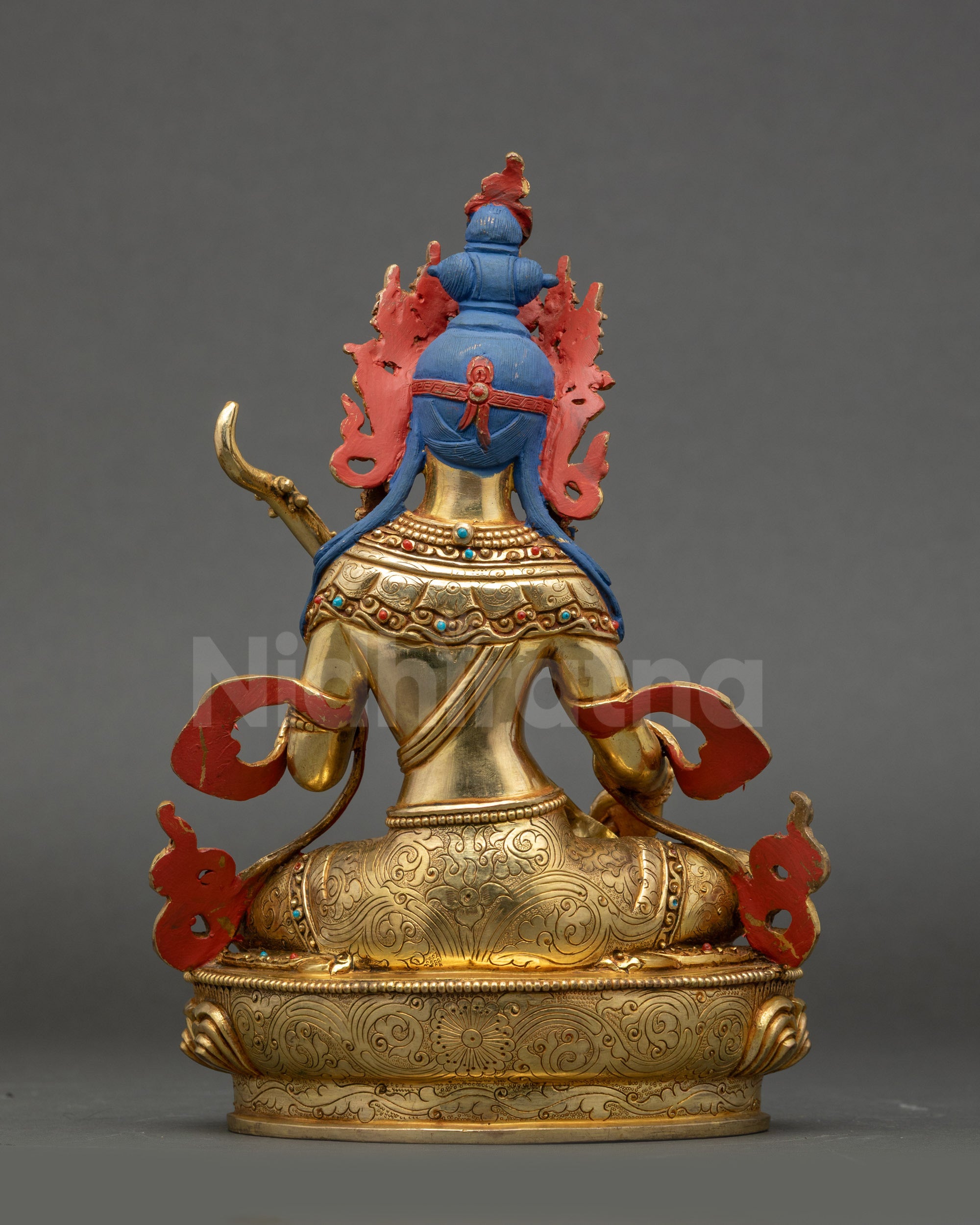 Back view of Saraswati Statue showing gold-gilded copper and carvings