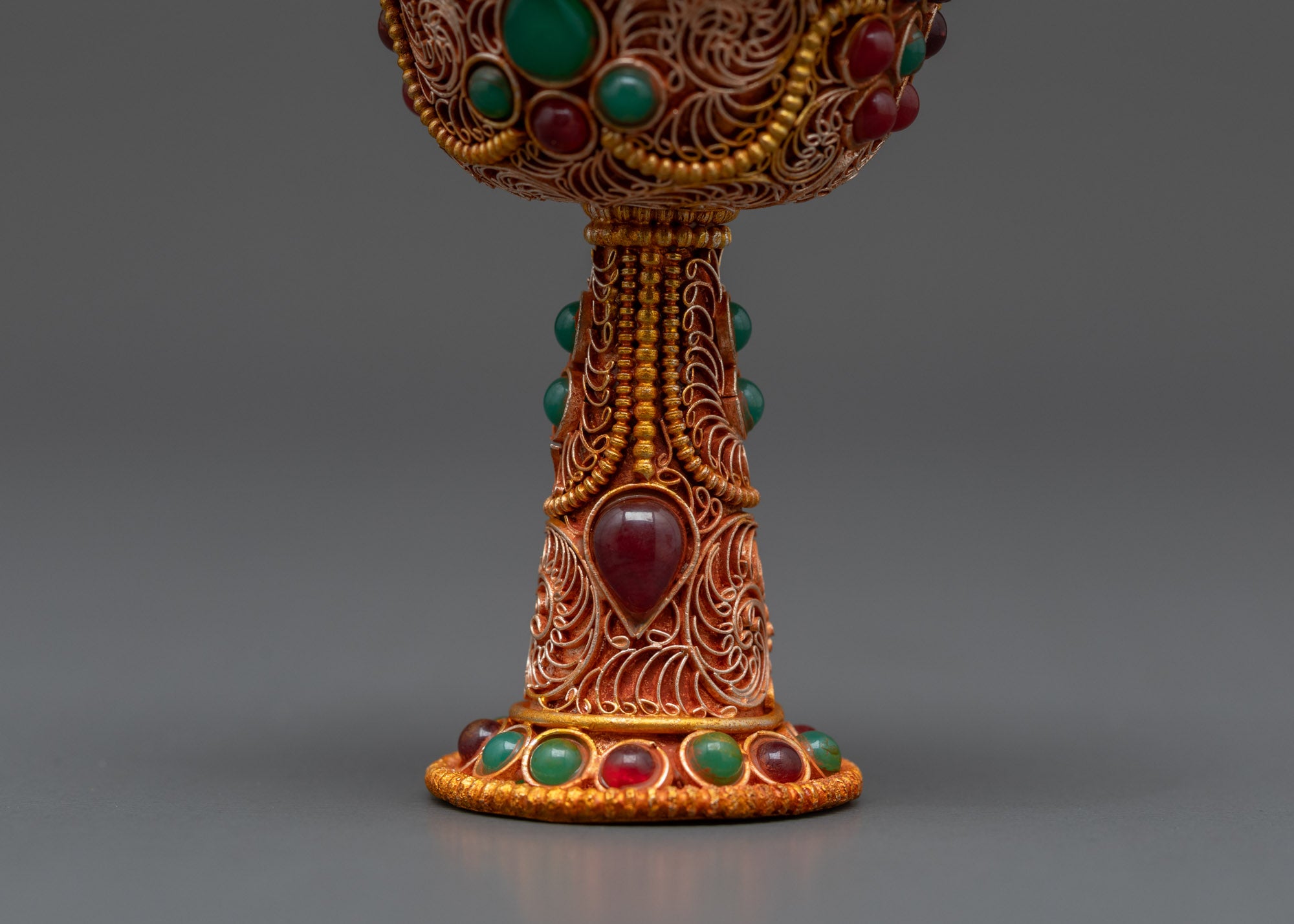 Back view of Serkyem Offering Bowl showing copper base and traditional Tibetan symbolic patterns
