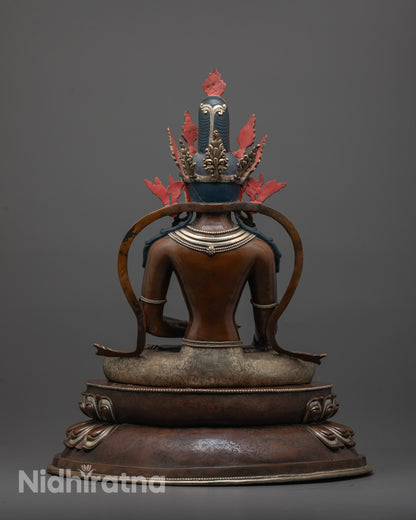 Back view of Shakyamuni Buddha Statue with detailed robe and oxidized copper finish