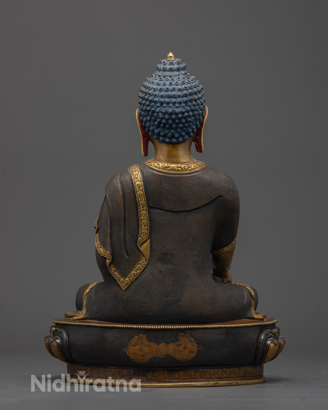 Back view of Shakyamuni Buddha Statue with hollow mantra section beneath lotus base