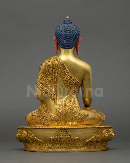 Back view of Shakyamuni Buddha figurine on lotus throne, fire-gilded finish