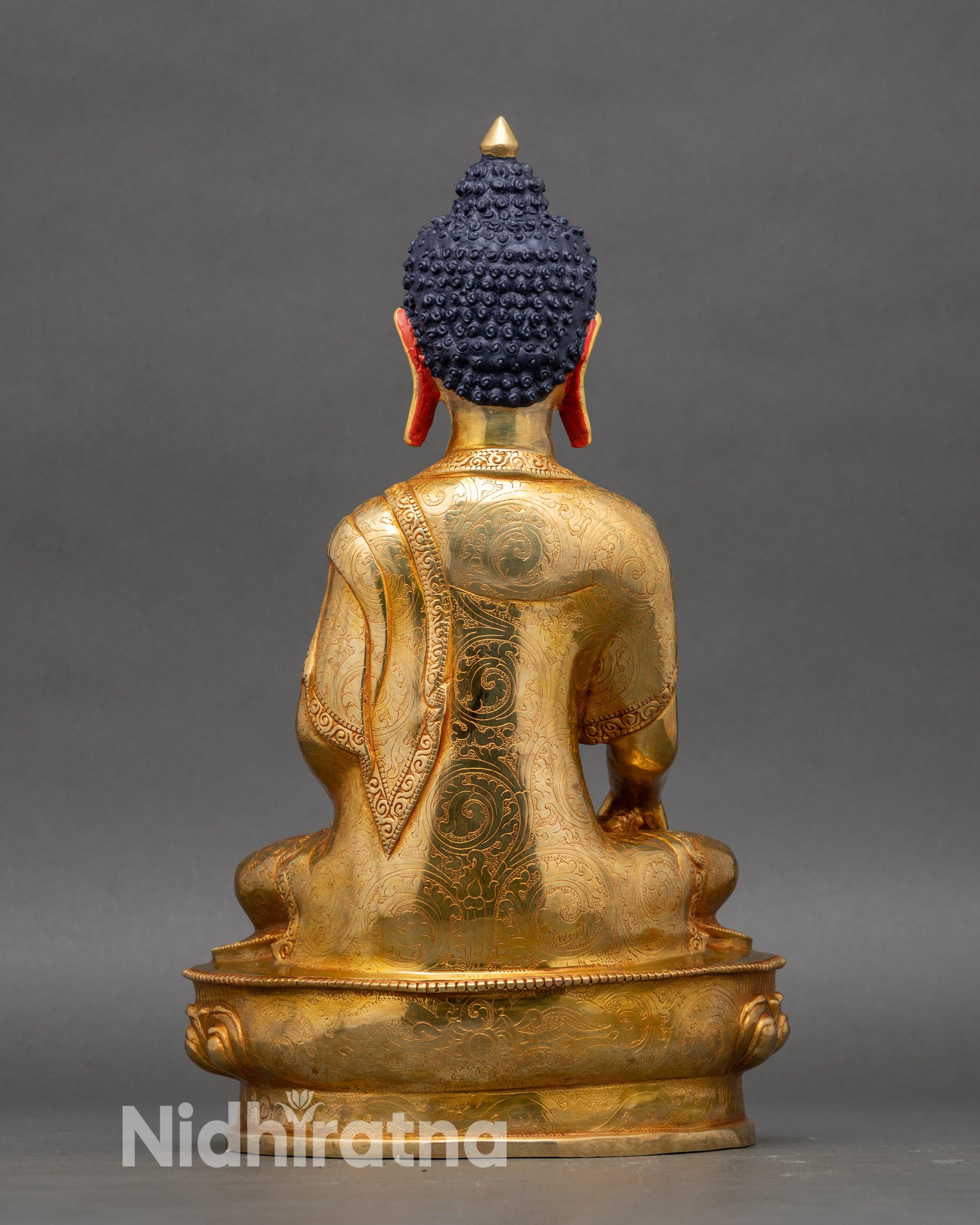 Back view of Shakyamuni Buddha meditation statue showing handcrafted copper detailing