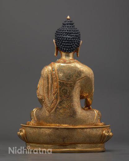 Shakyamuni Buddha sculpture highlighting the hollow chamber for mantras, silver-plated details, and ornate carvings on the robe.