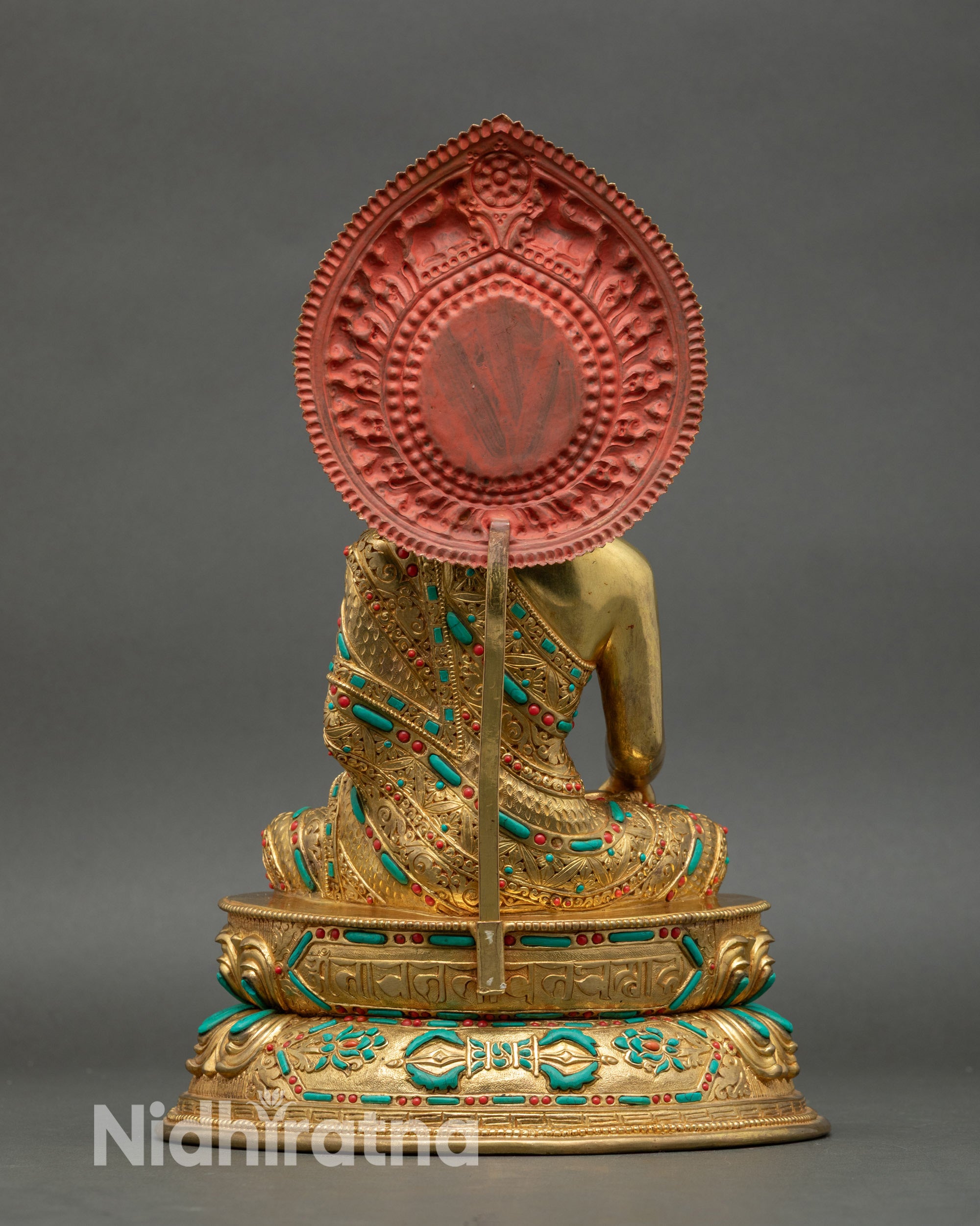 Back view of Shakyamuni Buddha, showing double-layer lotus seat and floral halo carving