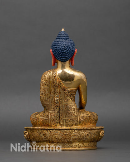 Back view of Shakyamuni Buddha, showing lotus pedestal and carved monastic robes