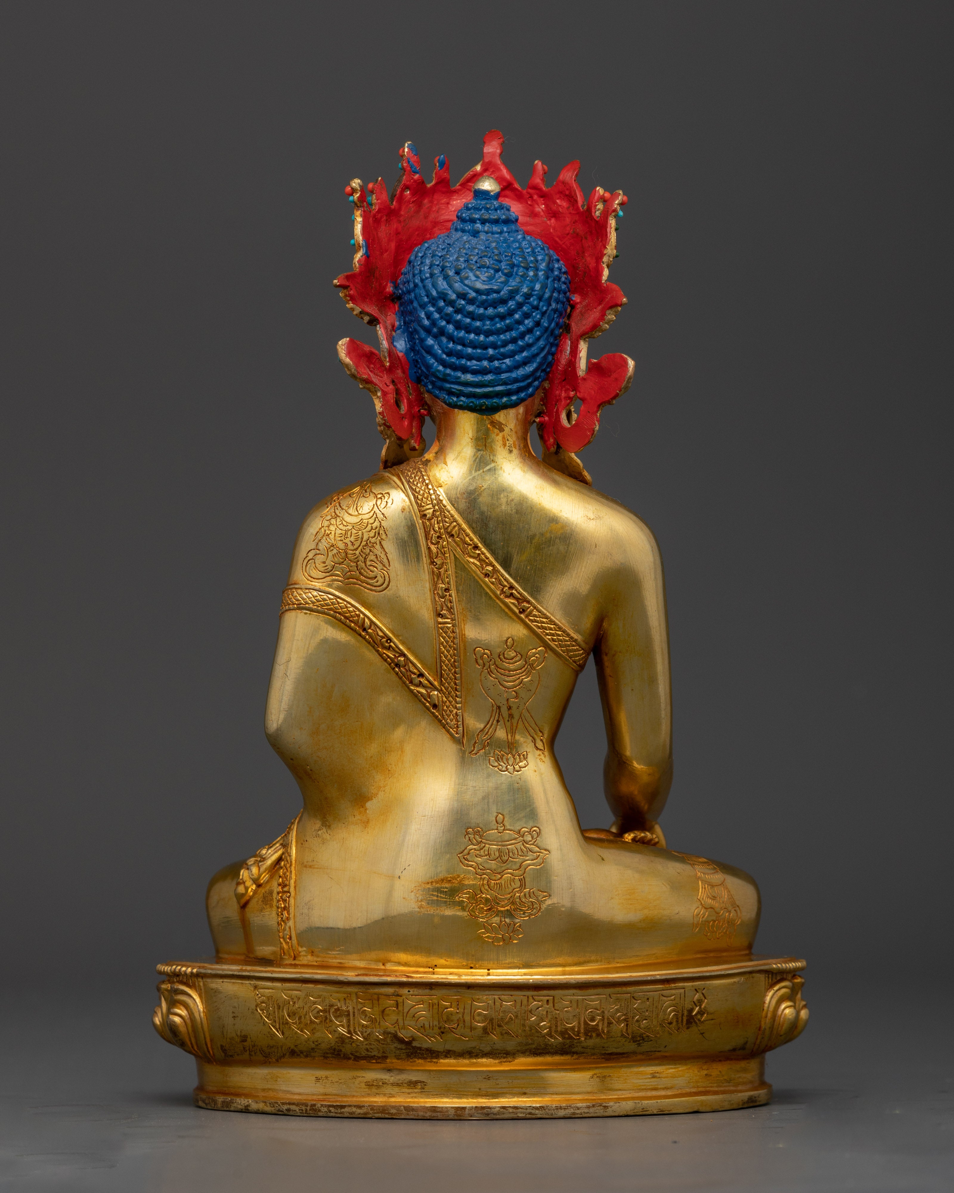 Back view of Shakyamuni Buddha statue highlighting detailed lotus seat and fire-gilded craftsmanship