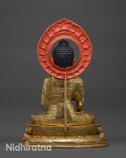 Back view of Shakyamuni Buddha statue highlighting robe patterns and copper finish