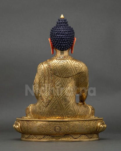 Back view of Shakyamuni Buddha statue, intricate robe patterns and lotus throne design