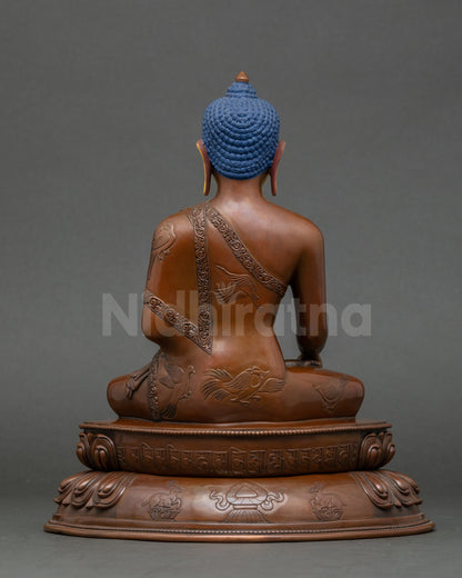Back view of Shakyamuni Buddha statue on double lotus throne with intricate details