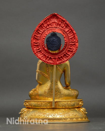 Back view of Shakyamuni Buddha statue, showing copper craftsmanship and divine halo