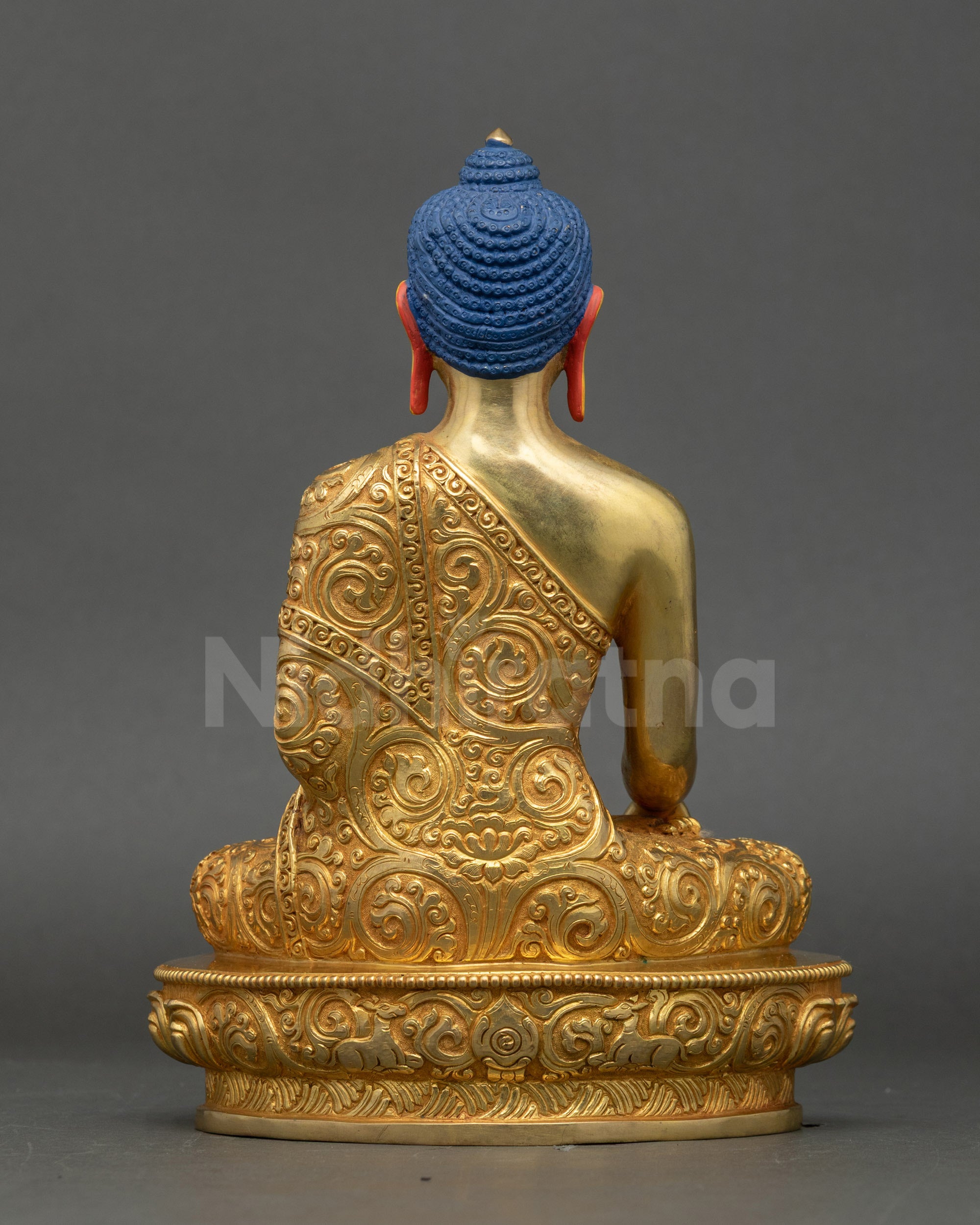 Back view of Shakyamuni Buddha statue showing sculpted robe and handcrafted finish
