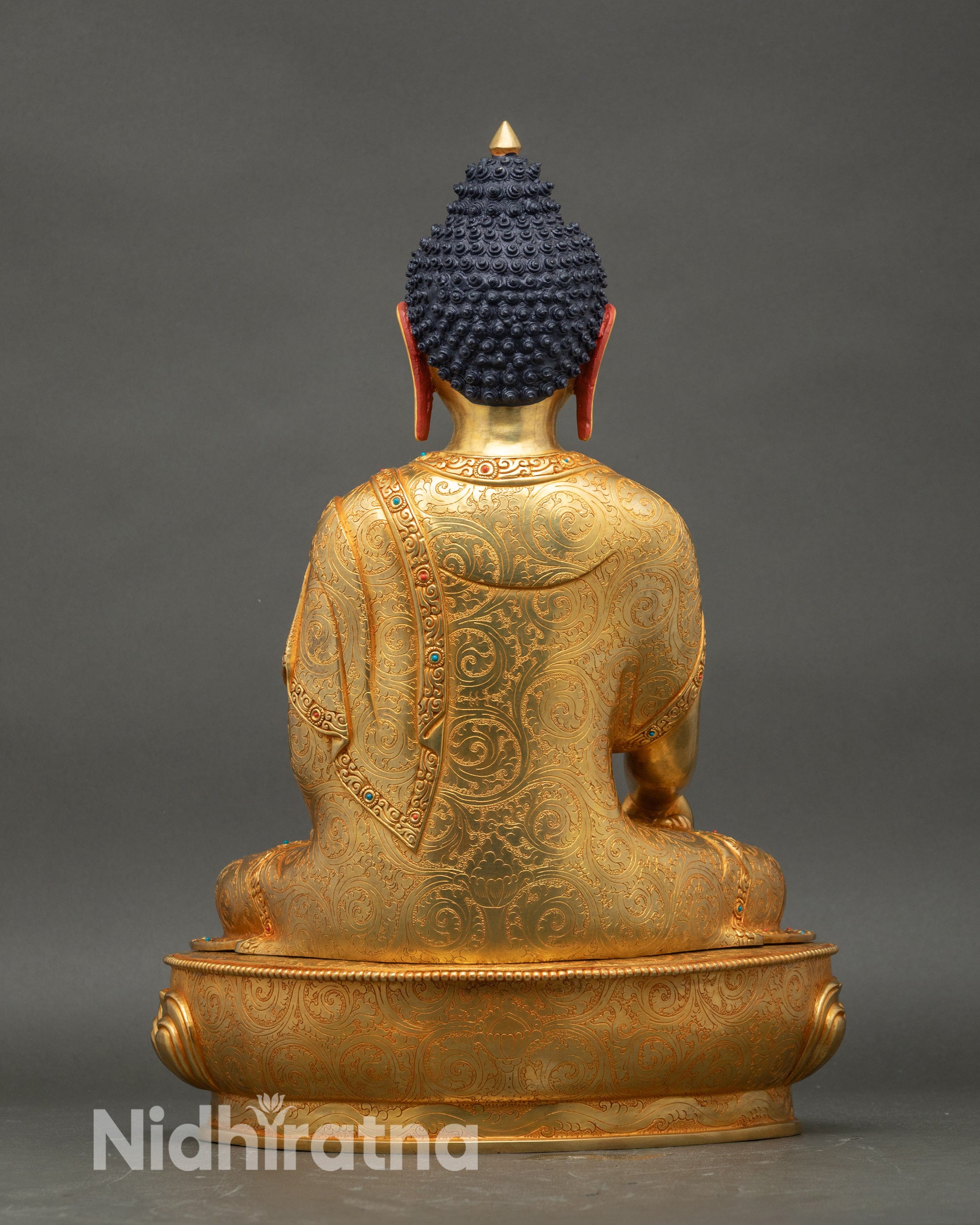 Back view of Shakyamuni Buddha statue with detailed robe carvings Nepal art