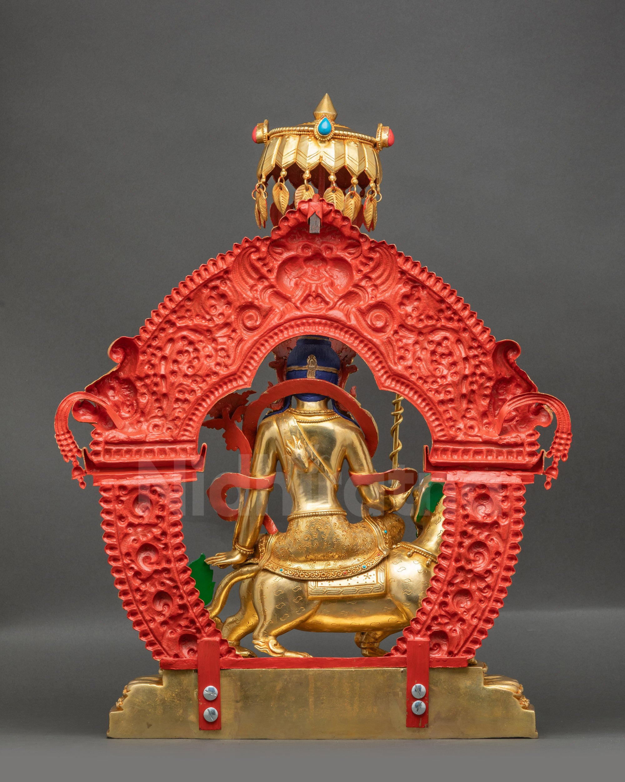 Back view of Simhada Chenrezig showing ornate halo and detailed carved garments