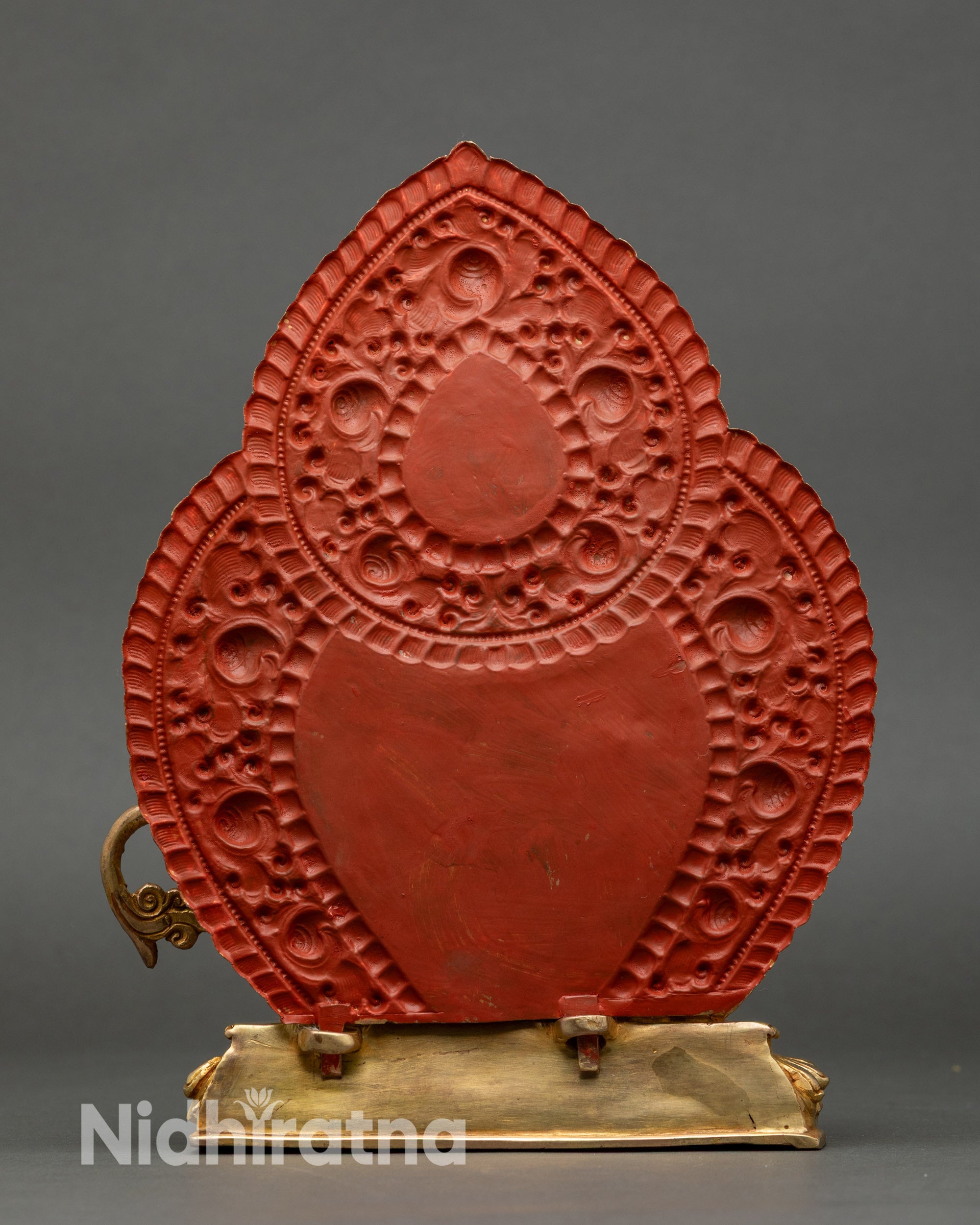 Back view of Simhada Manjushri statue showing carved lotus throne and halo details