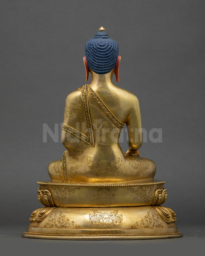 Back view of Tathagata Buddha Shakyamuni statue showing detailed robe engravings and lotus pedestal