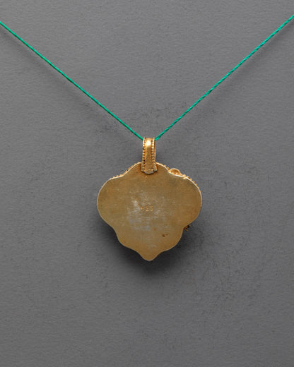 Back view of Tibetan Green Tara Locket, showcasing fine handcrafted carvings and traditional Himalayan metalwork craftsmanship.