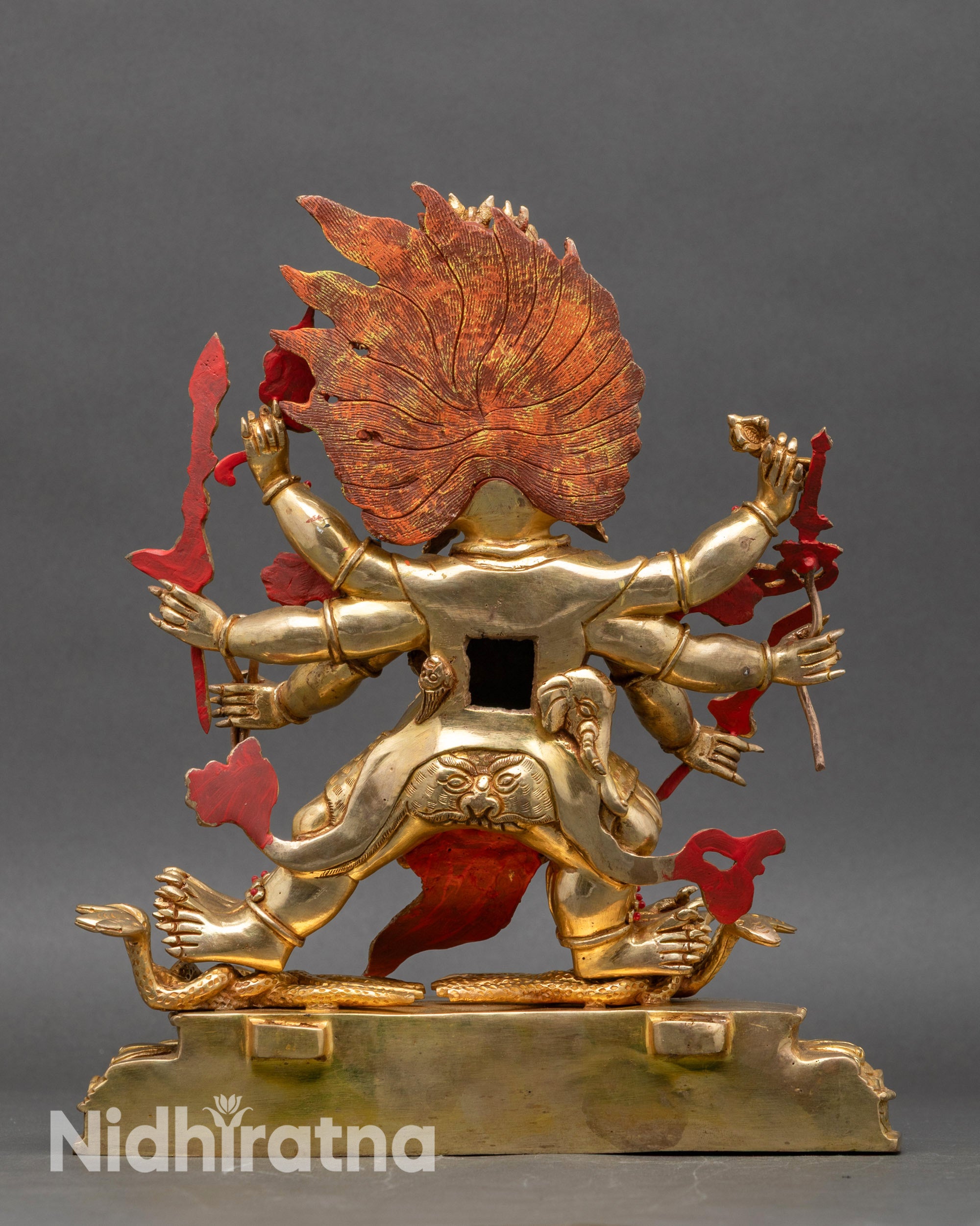 Back view of Tibetan Hayagriva statue showing intricate halo and lotus seat