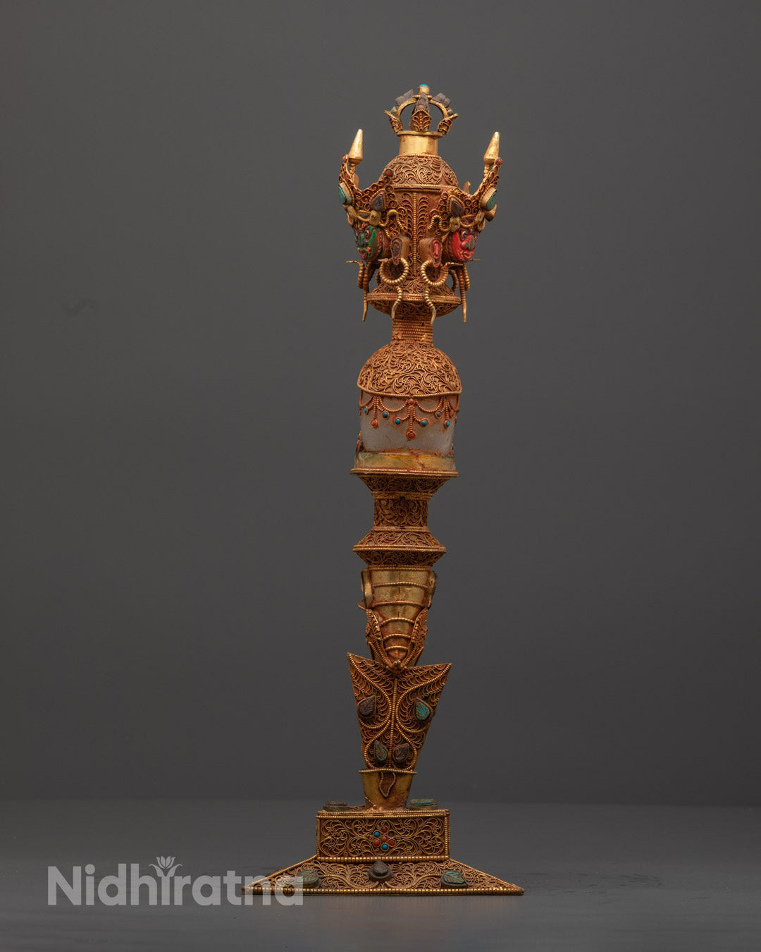 Back view of Tibetan Phurba revealing copper carvings and crystal clarity