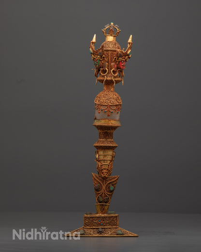 Back view of Tibetan Phurba revealing copper carvings and crystal clarity