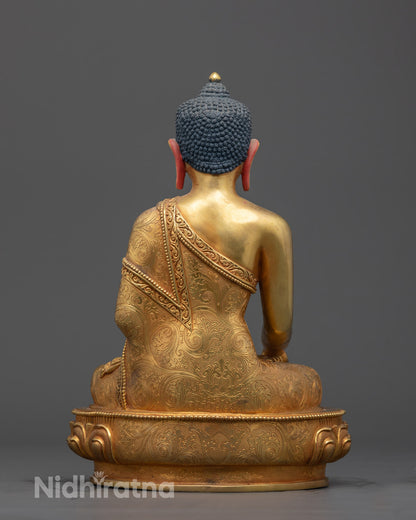 Back view of Tibetan Shakyamuni Buddha statue showing hollow base for mantras and offerings